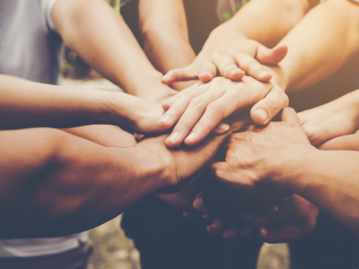 Image showing a group of hands on top of each other